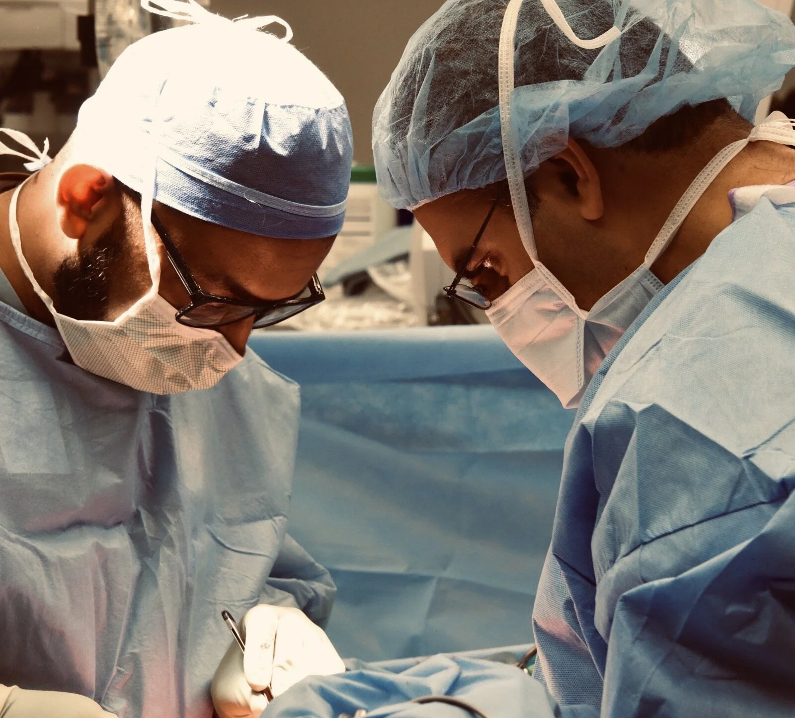 Dr Ashrafi (right) operating.